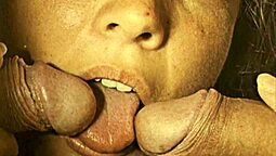 Vintage British man gives a handsjob and blowjob to a hairy pussy in this retro video