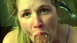A married woman in a blue dress performs oral sex on her husband during her lunch break