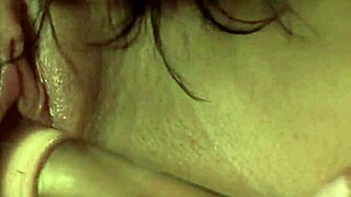 Tanned lesbian maid rams glass dildo in lover's asshole