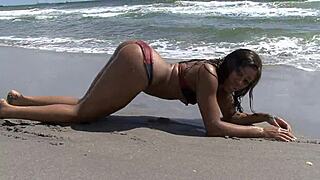 Ebony Babe Waves Dildo Deep in Dripping Beach Pussy