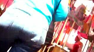 Suggestive milf jeans tease big curves on street stroll