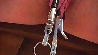 Amateur big pink pussy lips stretched dangled heavy weights close-up