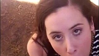 Young girl gives a blowjob in the open air on thickamatuers.com