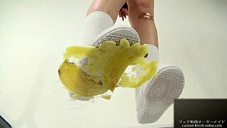 asian japanese girl crushes banana with feet in fetish