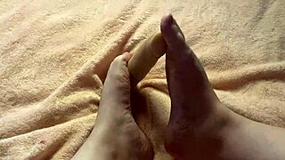 slow, teasing footjob from a curvy barefoot girl in this homemade fetish video