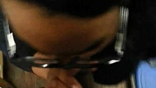 This ebony babe in glasses sucks and swallows cum like a pro!
