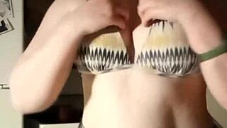 want to see this busty slut playing with her tits?