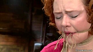 Watch this ginger milf get fingered while hogtied?