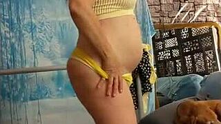 Watch as a redheaded amateur wife seduces her husband with her seductive dance moves