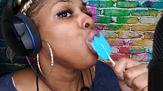 Ebony babe indulges in oral pleasure with a lollipop