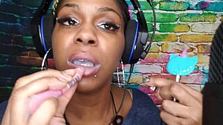 Ebony babe indulges in oral pleasure with a lollipop