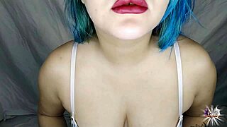 Close-up video of a sexy MILF applying lipstick to her lips