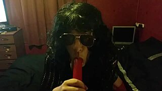 Crossdressing bisexual sissy demonstrates cock sucking skills with dildo in ass to mouth action