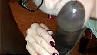 Ebony babe gives a sloppy blowjob to a big black cock