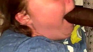 A Caucasian woman gives a sloppy blowjob to a big black cock in Stockton