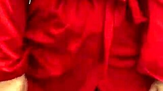 Brunette in red lingerie teases herself real good