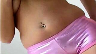 Blonde Babe Teases with Tight Purple PVC Panties on Ass