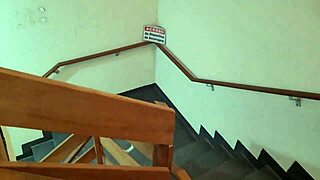 Staircase condominium fuck with two friends using condom for intense action