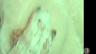 Beautiful woman performs an adorable sexy dance in her bikini inside the bathroom