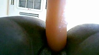 She bends over in doggystyle, using a dildo to fuck herself to orgasm.