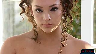 Exotic milf with big tits and shaved pussy poses in softcore scene.