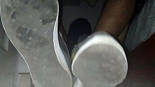 Blue sweaty socks and bare feet with a spill