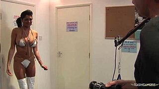 Two seductive brunette beauties share a passionate encounter with three fortunate men on a couch