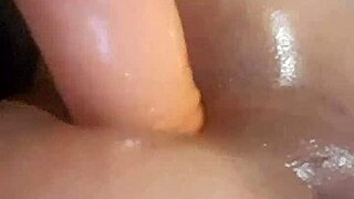 A narrow transgender woman pleasures herself with an enormous dildo