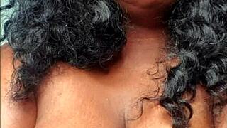 A sexy African American woman with a large buttocks and breasts