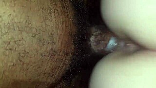 A steamy encounter of a fair-skinned adolescent receiving a load from a ebony shaft