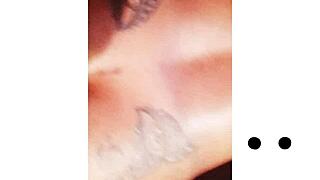 Npleasures bends over to show off her new ass tattoo in doggystyle pose