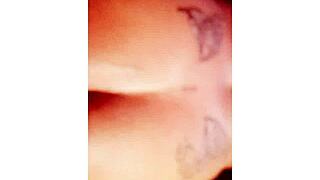 Npleasures bends over to show off her new ass tattoo in doggystyle pose