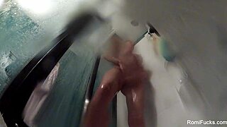 Romi rain enjoys a steamy shower, touching her big tits and ass