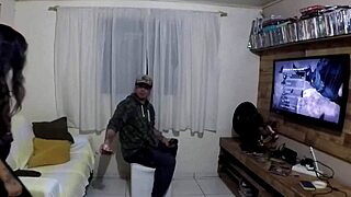 While he plays PlayStation 2, she gets fucked by a big cock amateur