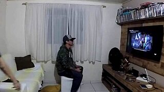 While he plays PlayStation 2, she gets fucked by a big cock amateur