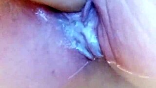 She's in the creamy bathtub, solo dildoing her wet pussy