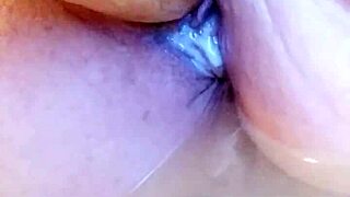 She's in the creamy bathtub, solo dildoing her wet pussy
