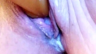 She's in the creamy bathtub, solo dildoing her wet pussy