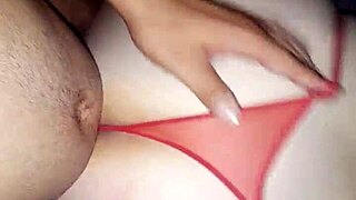 A faithful wife of a certain age kneels and gives blow jobs to another man in her husband’s bed while he is away.