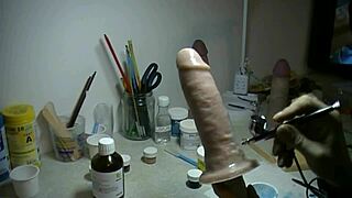 Applying paint to prosthetic penis