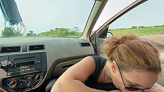 Blowjob session unfolds in the car with big tits