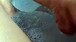 Amateur BBW enjoys a solo bath with foot fetishists in mind.