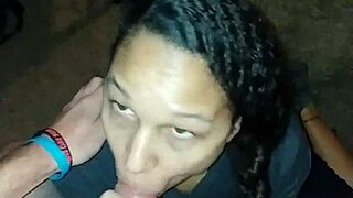 A light-skinned woman with a golden complexion enjoys sucking and swallowing semen.