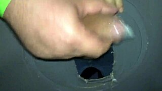 guy jerks off at swing house through glory hole