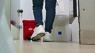 Spanish pervert films public shower at Madrid airport
