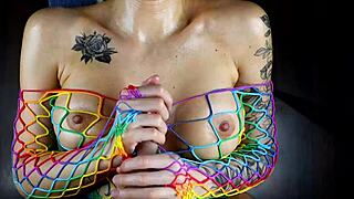 Oiled Tattoo Girl Gets Intense Titfuck Cumshot Close Up POV