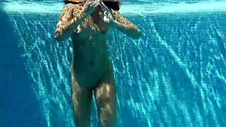 Russian teen Jessica Lincoln shows off her tattoos while swimming