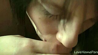 Black-haired beauty gives great blow job to her man