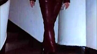 Femdom in leather catsuit and pantyhose with miniskirt