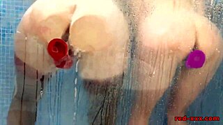 Red And Lucy Seductively Fuck Their Toys In The Shower